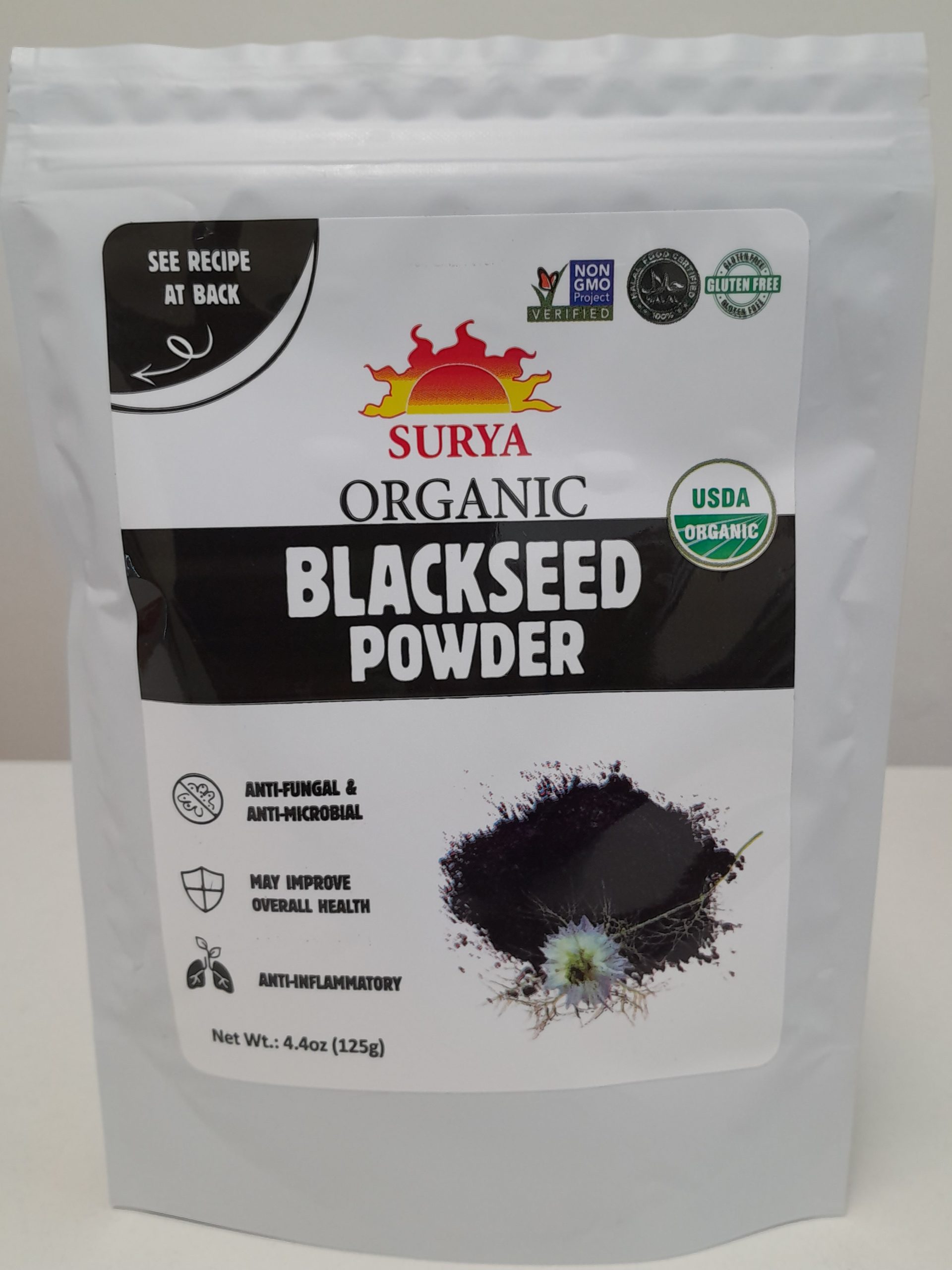 Surya Organic Blackseed Powder resealable pouch front label showing USDA Organic, Non-GMO, and gluten-free certifications with black seed powder image.