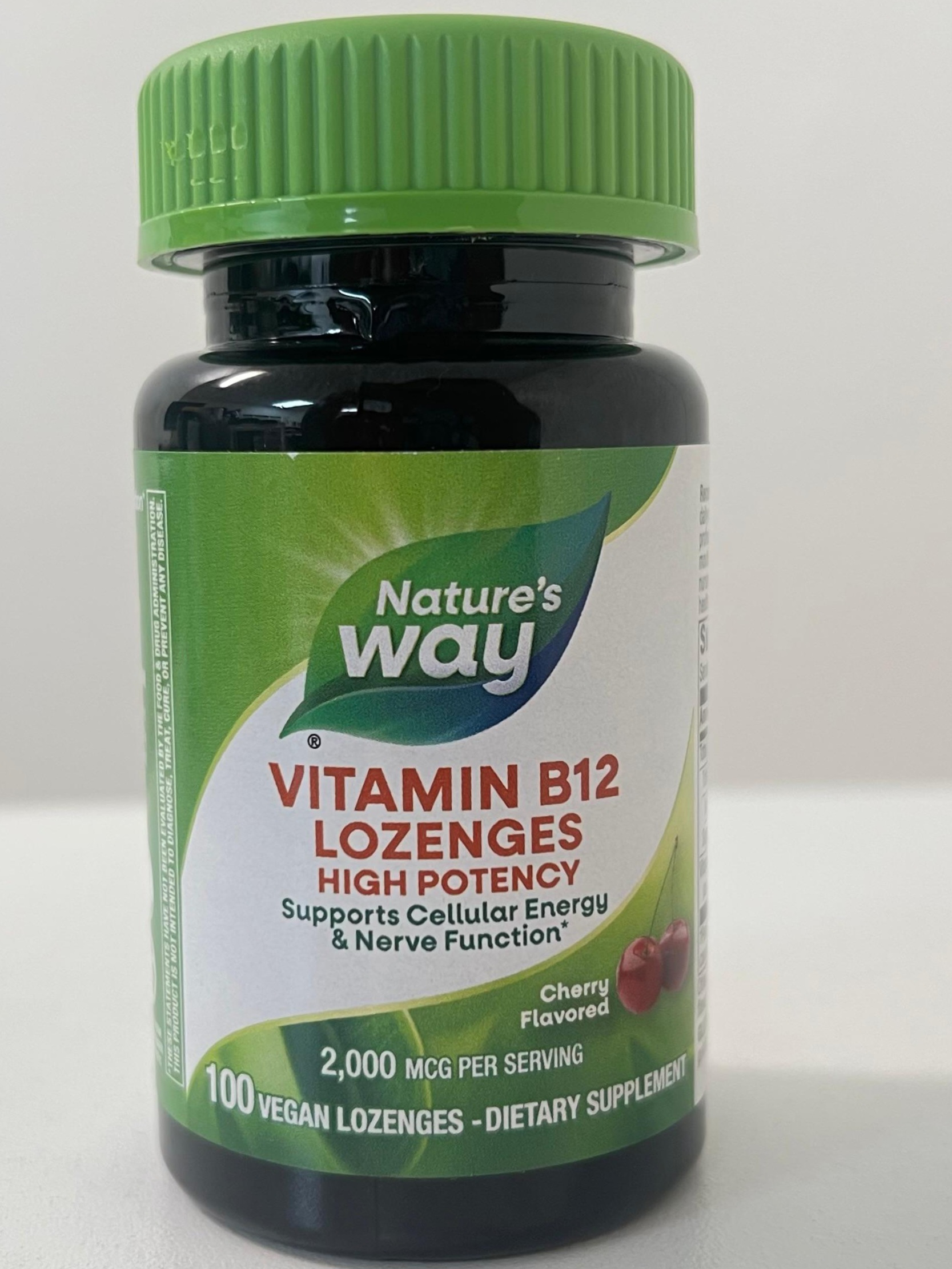 Front view of Nature’s Way Vitamin B12 High Potency Lozenges bottle with a green cap, showing the label highlighting 2,000 mcg per serving, cherry flavor, and 100 vegan lozenges for cellular energy and nerve function support.