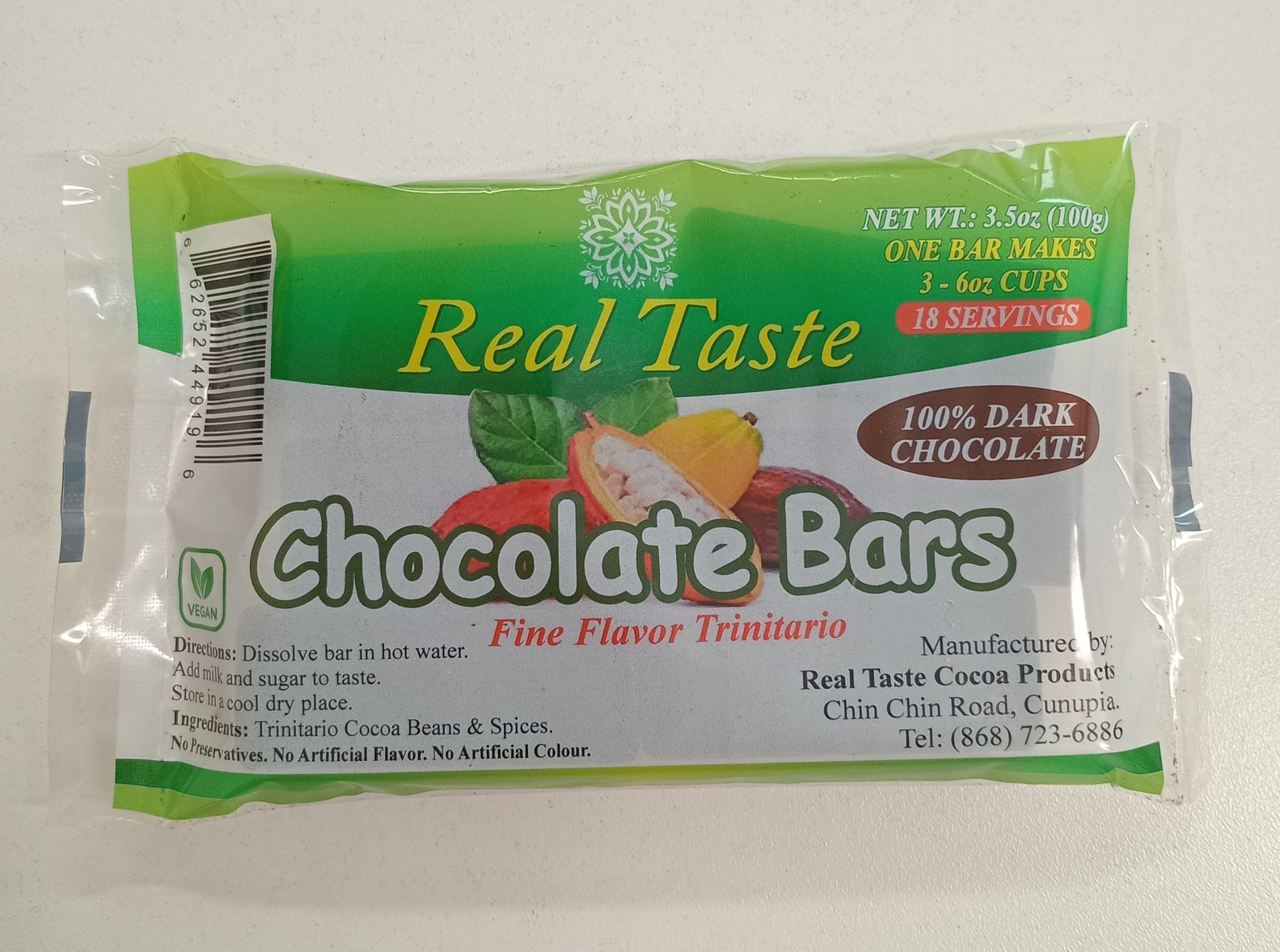 Package of Real Taste Fine Flavor Trinitario Chocolate Bars, labeled as 100% dark chocolate. The front shows cocoa pods and includes instructions, ingredients, and manufacturer details.