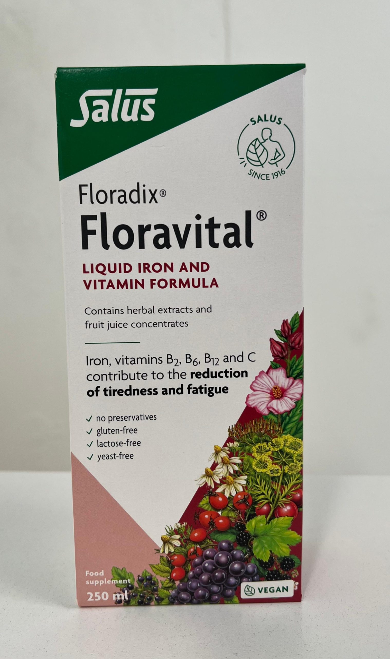 Salus Floradix Floravital liquid iron and vitamin formula box, 250 ml, featuring herbal and fruit imagery, labeled vegan and free from preservatives.
