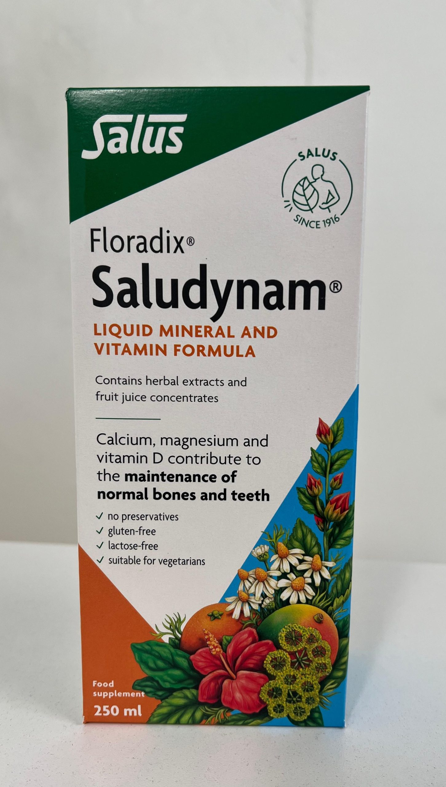 Salus Floradix Saludynam liquid mineral and vitamin formula box, 250 ml, with colorful botanical illustrations and labeled gluten-free and vegetarian.
