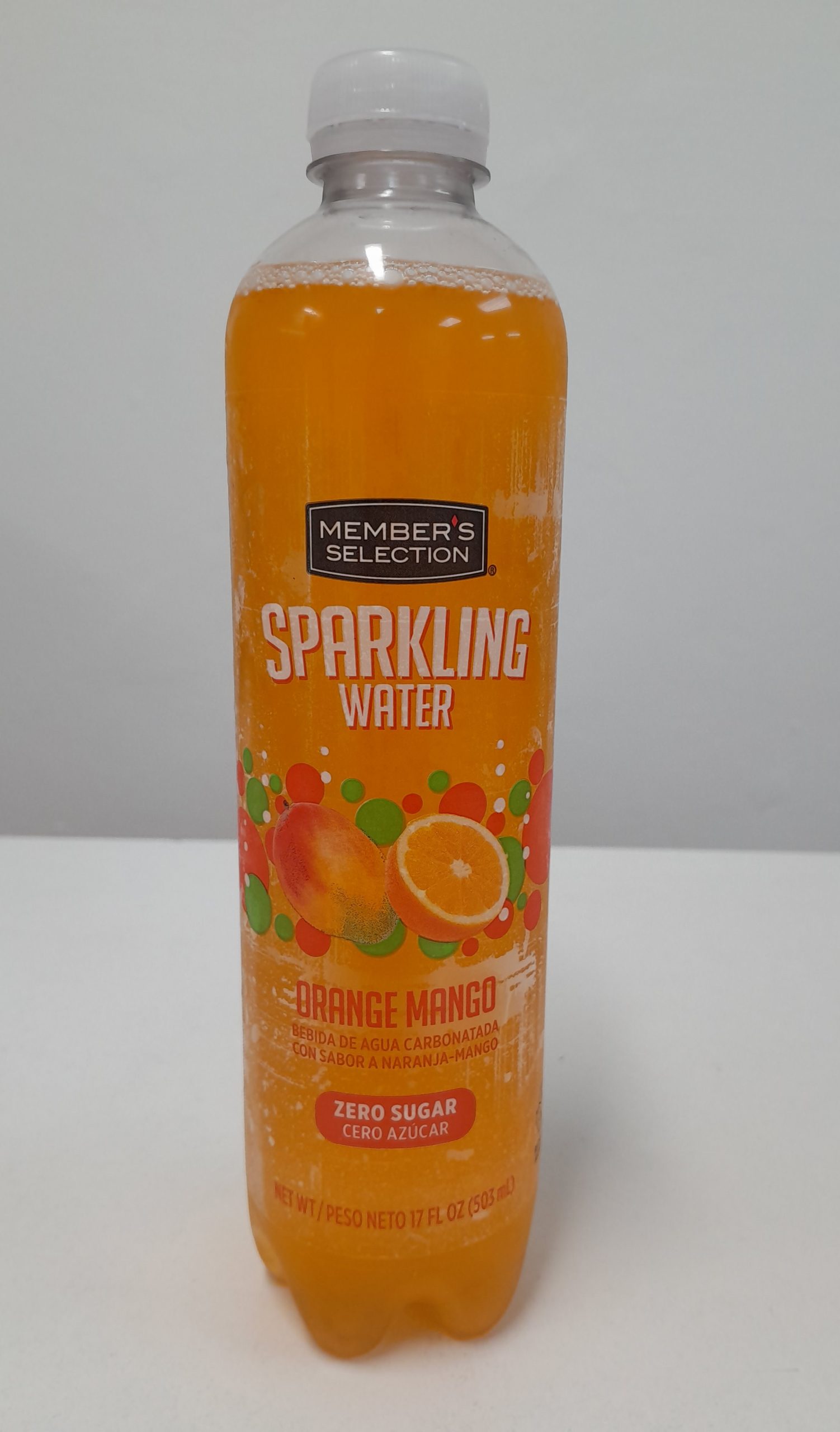Member’s Selection Orange Mango sparkling water nutrition facts label, zero sugar carbonated beverage bottle.