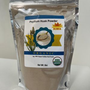 Close-up of Surya Psyllium Husk Powder packaging showing reflective silver pouch with label.