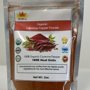 Front view of Surya Organic Cayenne Pepper Powder (180,000 heat units) in a silver resealable pouch featuring red chili peppers and organic certification labels.