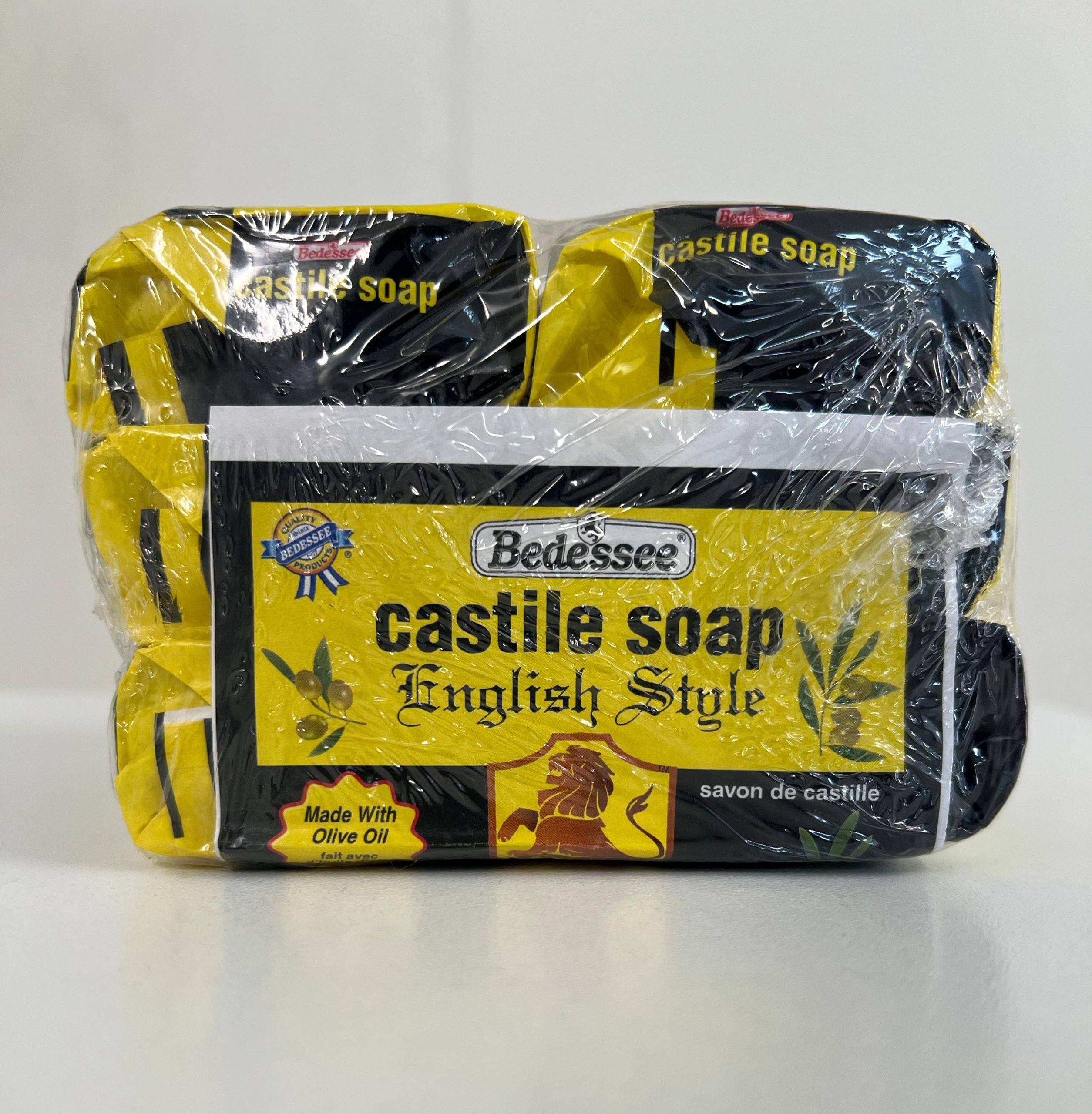 Top view of Bedessee Castile Soap English Style 6-pack bars wrapped in plastic packaging made with olive oil.